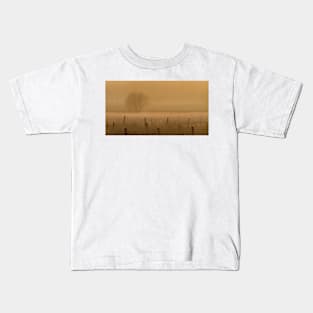 Fence posts in fog Kids T-Shirt